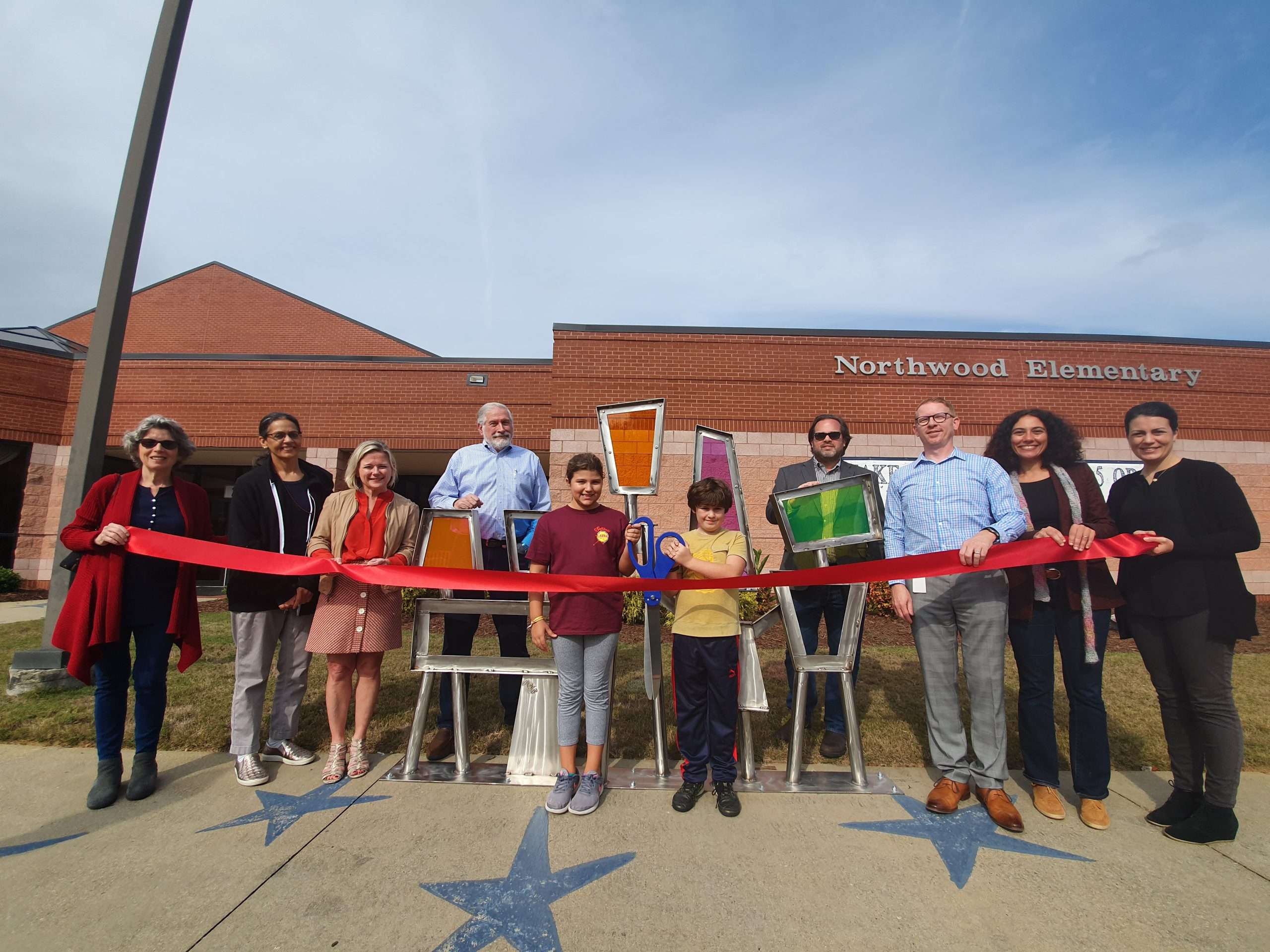 Ribbon cutting. "Unity" by Nathan Pierce. Located at Northwood Elementary.  Sponsored by Northwood Foundation.